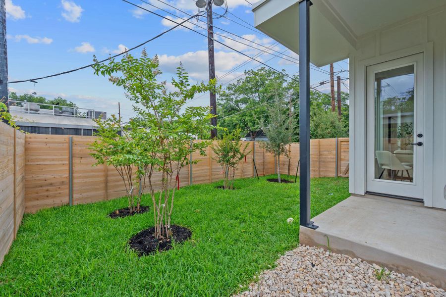 Fenced backyard featuring a patio
