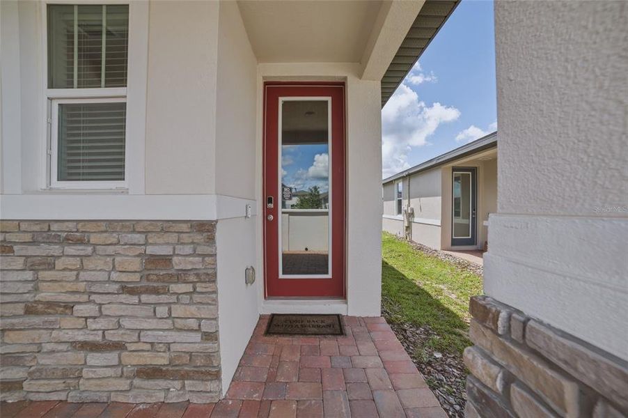 Exterior details and patio area of a home in Springs at Lake Alfred - Classic Series, Lake Alfred (Image 24).