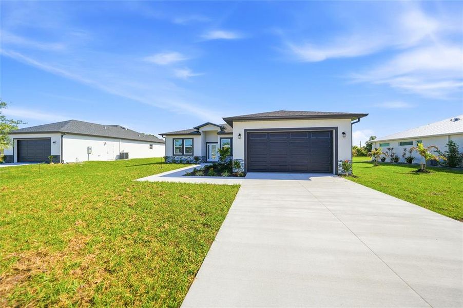 Front exterior of a new home in , Punta Gorda, FL, highlighting curb appeal (Image 28).
