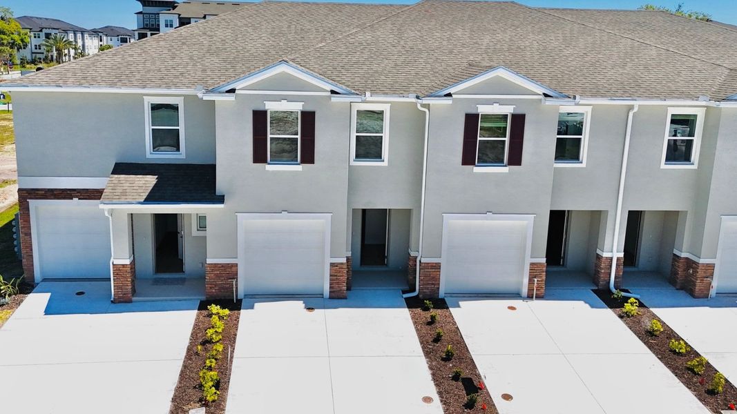 Front exterior of a new home in Nona West, Orlando, FL, highlighting curb appeal (Image 1). Front exterior of a new home in Nona West, Orlando, FL, highlighting curb appeal (Image 1).