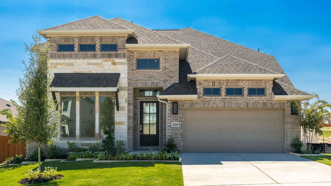 French provincial home with driveway, brick siding, and roof with shingles French provincial home with driveway, brick siding, and roof with shingles