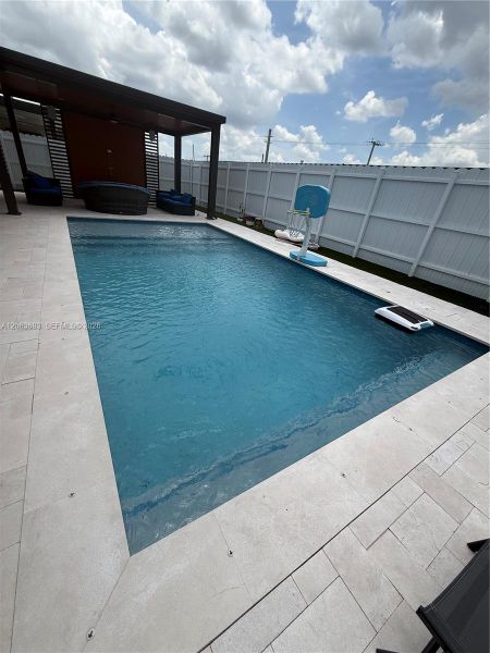 Exterior details and patio area of a home in Beacon at Galiano Pointe, Miami (Image 2). Exterior details and patio area of a home in Beacon at Galiano Pointe, Miami (Image 2).
