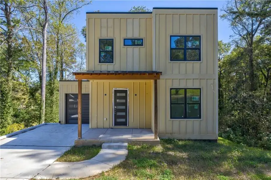 Front exterior of a new home in , Hapeville, GA, highlighting curb appeal (Image 8).