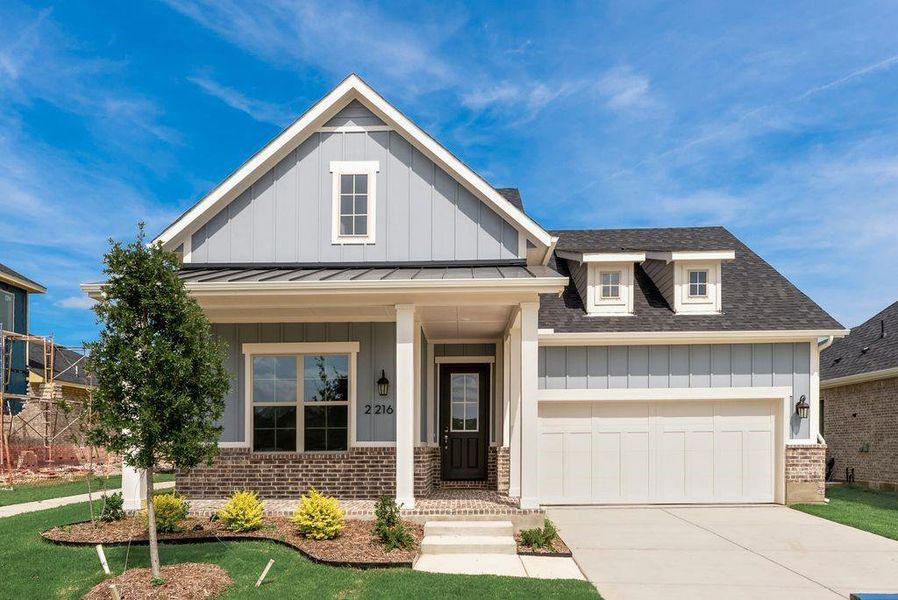 Front exterior of a new home in Bayside, Rowlett, TX, highlighting curb appeal (Image 20).