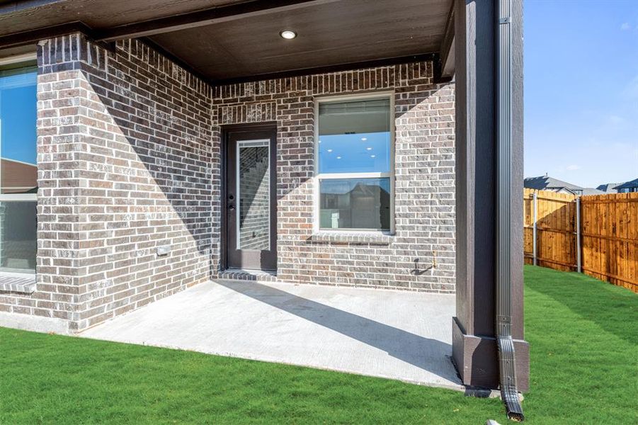 Exterior details and patio area of a home in West Crossing, Anna (Image 3).
