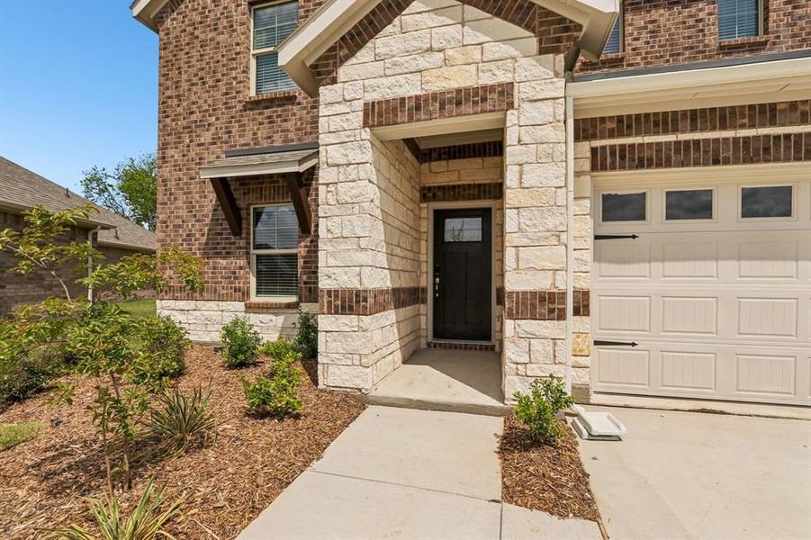 Exterior details and patio area of a home in Parks at Foster Crossing - Premier Series, Anna (Image 2). Exterior details and patio area of a home in Parks at Foster Crossing - Premier Series, Anna (Image 2).