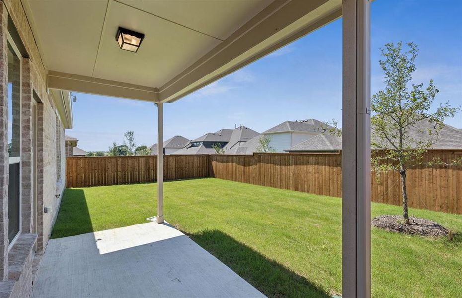 Oversized yard with covered patio *Real home pictured Oversized yard with covered patio *Real home pictured