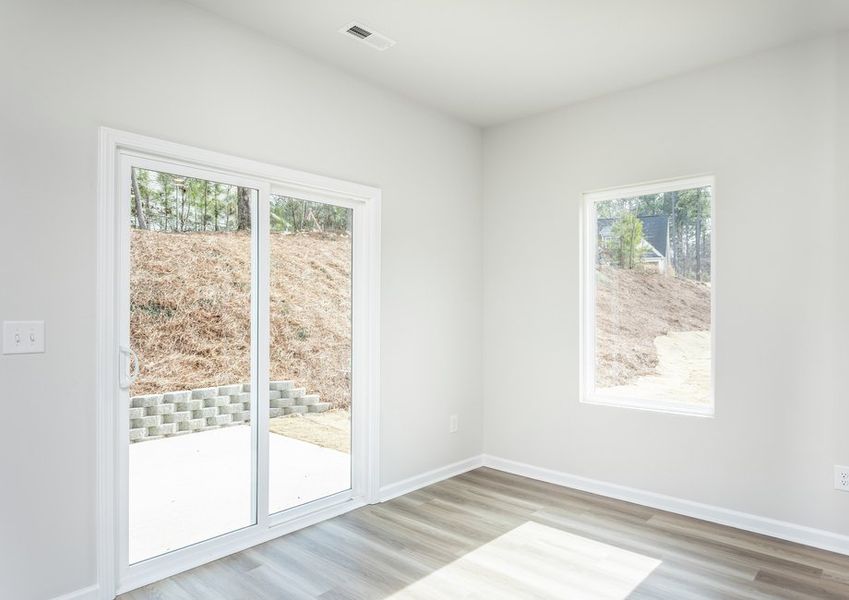 Enjoy breakfast at the well lit dining space. Enjoy breakfast at the well lit dining space.