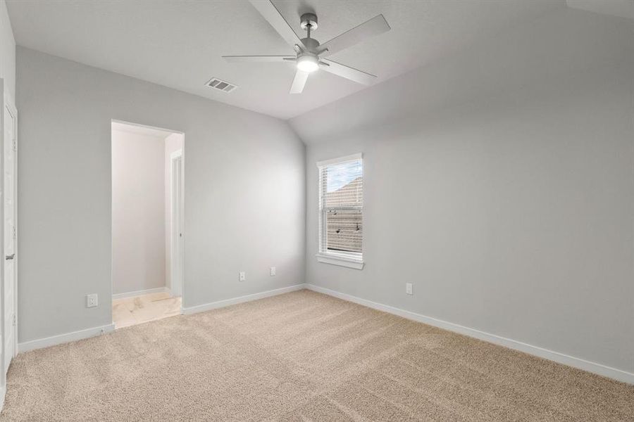 Secondary bedroom features plush carpet, custom paint, large window with privacy blinds and access to the Jack and Jill bath. Sample photo of completed home with similar floor plan. Actual colors and selections may vary.