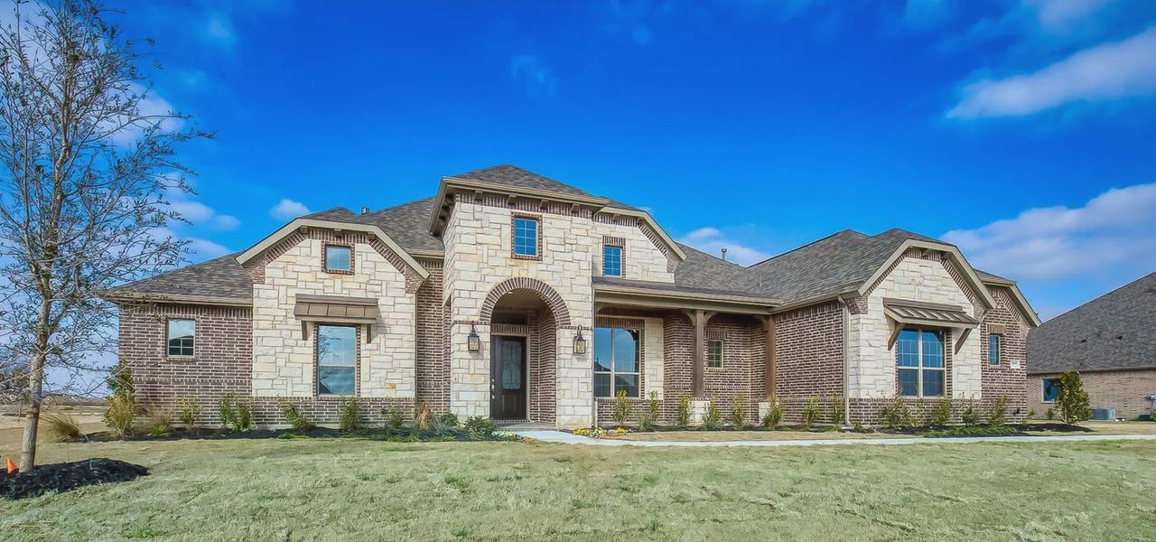 Representative exterior photo of a completed home built from the Loures by Chesmar Homes in Lakeway Estates, Waxahachie, TX (Image 9). Representative exterior photo of a completed home built from the Loures by Chesmar Homes in Lakeway Estates, Waxahachie, TX (Image 9).