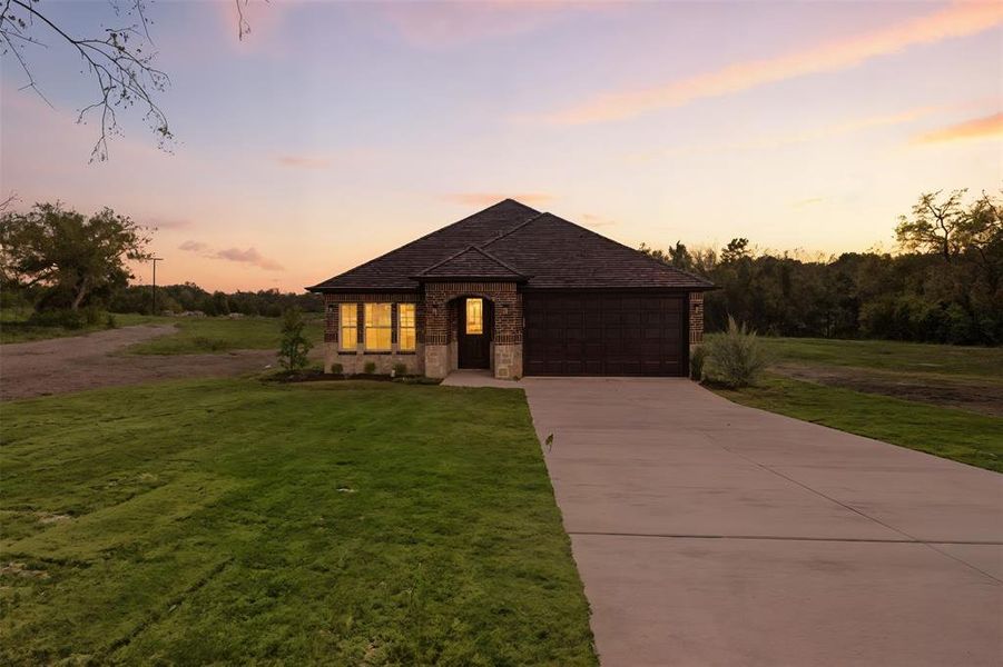 Front exterior of a new home in , Tom Bean, TX, highlighting curb appeal (Image 2).