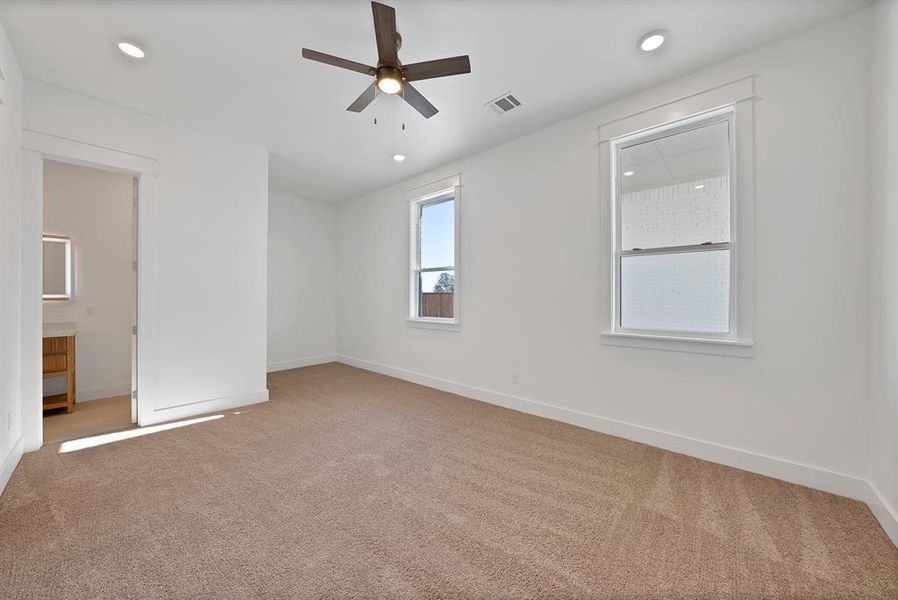 Unfurnished room with light colored carpet, a ceiling fan, and recessed lighting