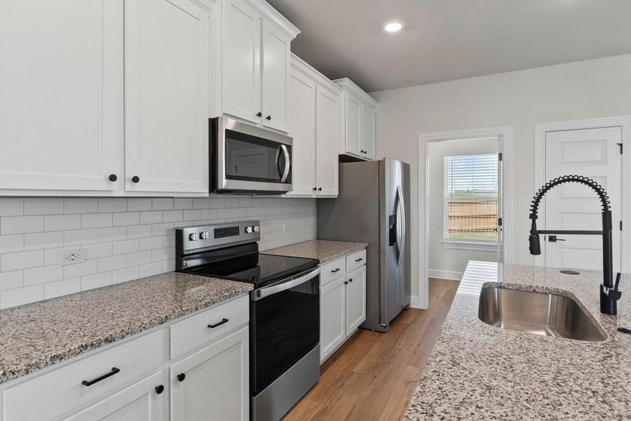 Furnished interior view inside a new home in Whisper Valley, Manor (Image 7).