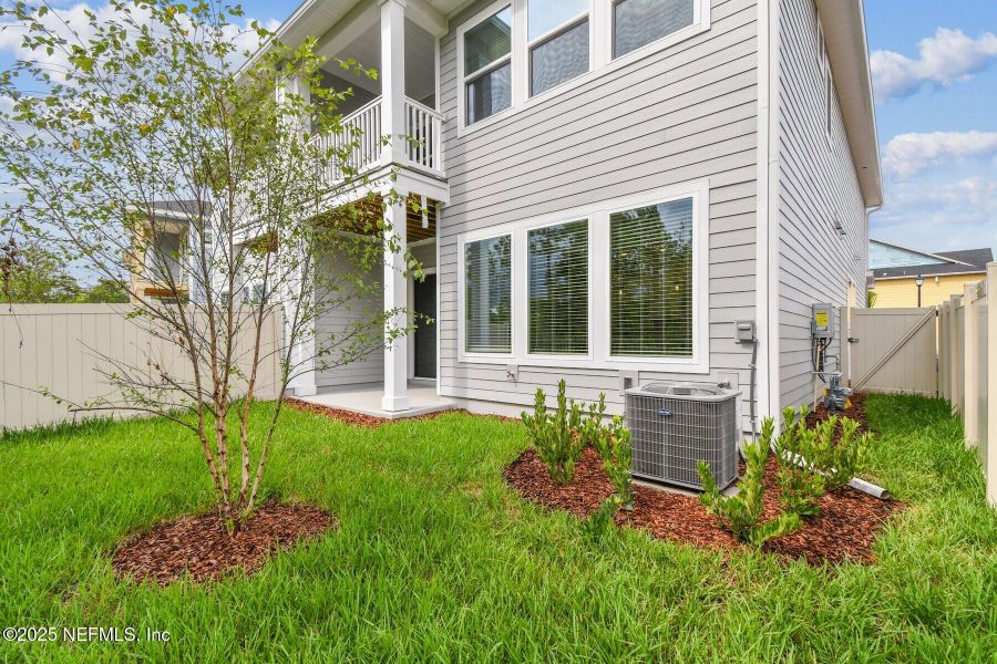 Front exterior of a new home in Kettering at eTown - Paired Villas, Jacksonville, FL, highlighting curb appeal (Image 1).