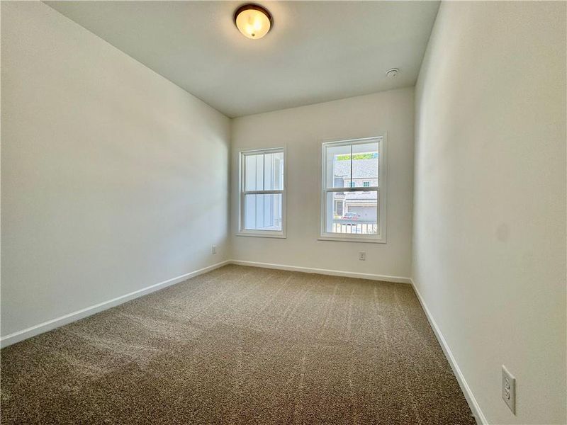 Spacious, unfurnished interior of a new home in Eastlyn Crossing, Flowery Branch (Image 13).