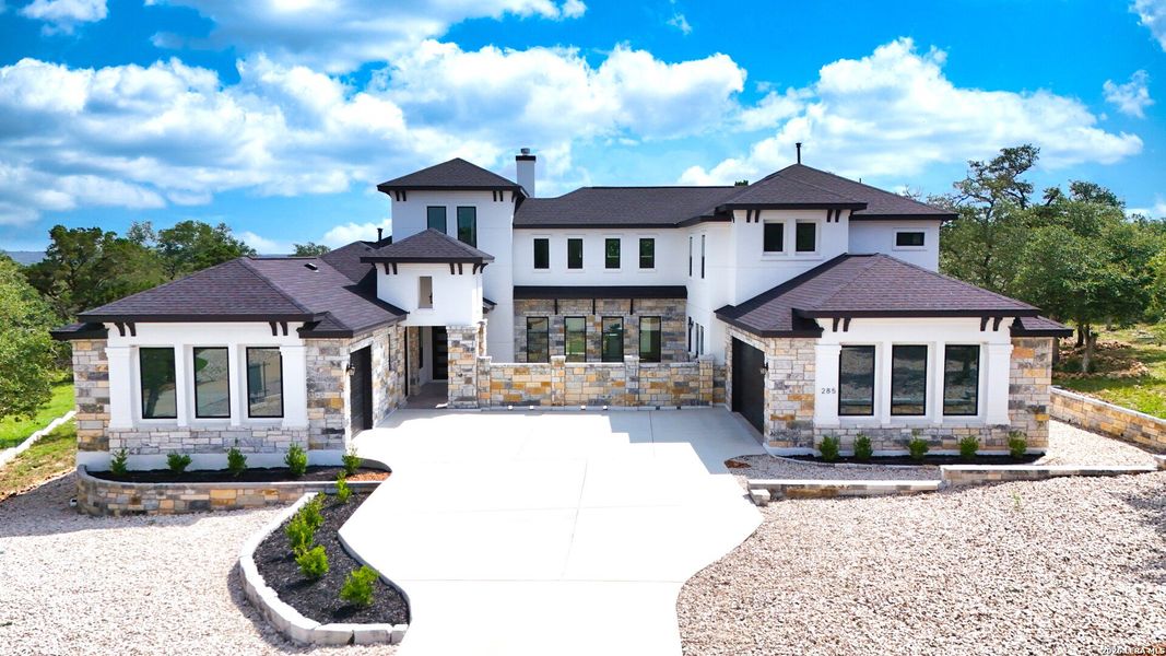 Front exterior of a new home in , New Braunfels, TX, highlighting curb appeal (Image 34).