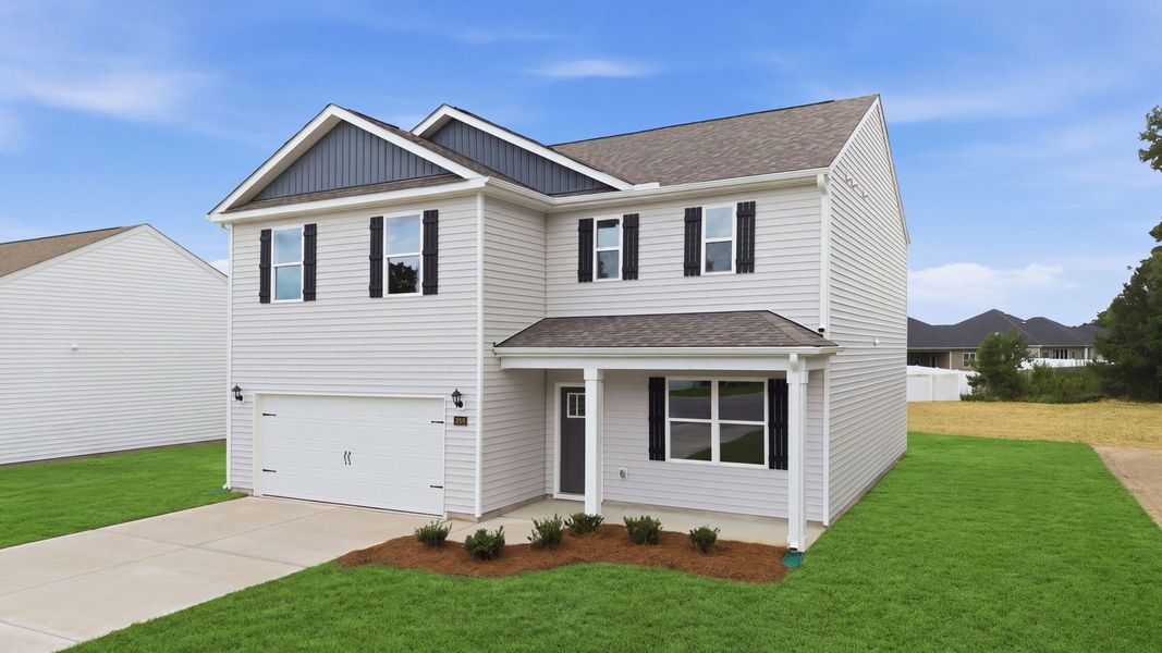 Front exterior of a new home in Villa Grande, Winterville, NC, highlighting curb appeal (Image 18). Front exterior of a new home in Villa Grande, Winterville, NC, highlighting curb appeal (Image 18).