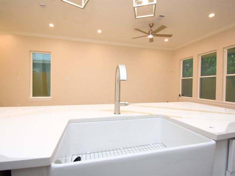 Large farm style sink facing family room.