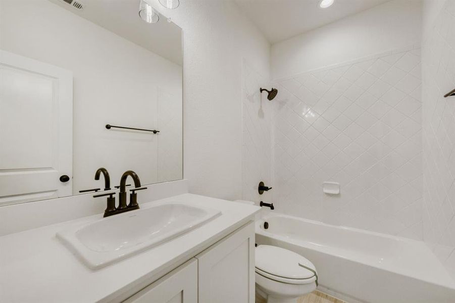 Bathroom with vanity and bathtub / shower combination Bathroom with vanity and bathtub / shower combination