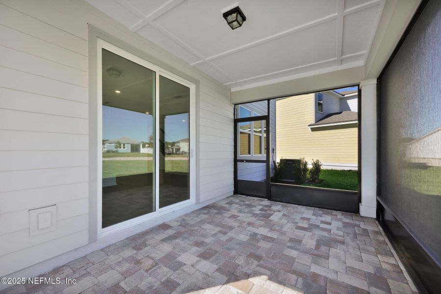 Exterior details and patio area of a home in The Preserve at Bannon Lakes, St. Augustine (Image 3).