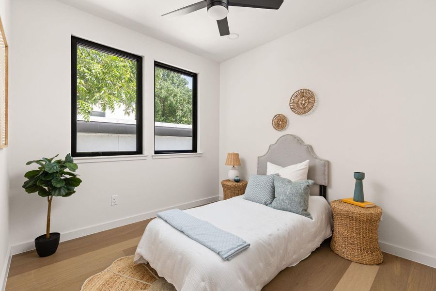 Hardwood floors and generous natural light create an inviting personal sanctuary.