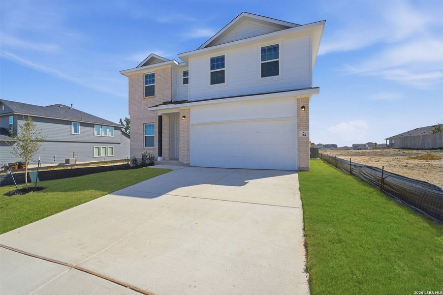 Front exterior of a new home in Hunter's Ranch, San Antonio, TX, highlighting curb appeal (Image 19).