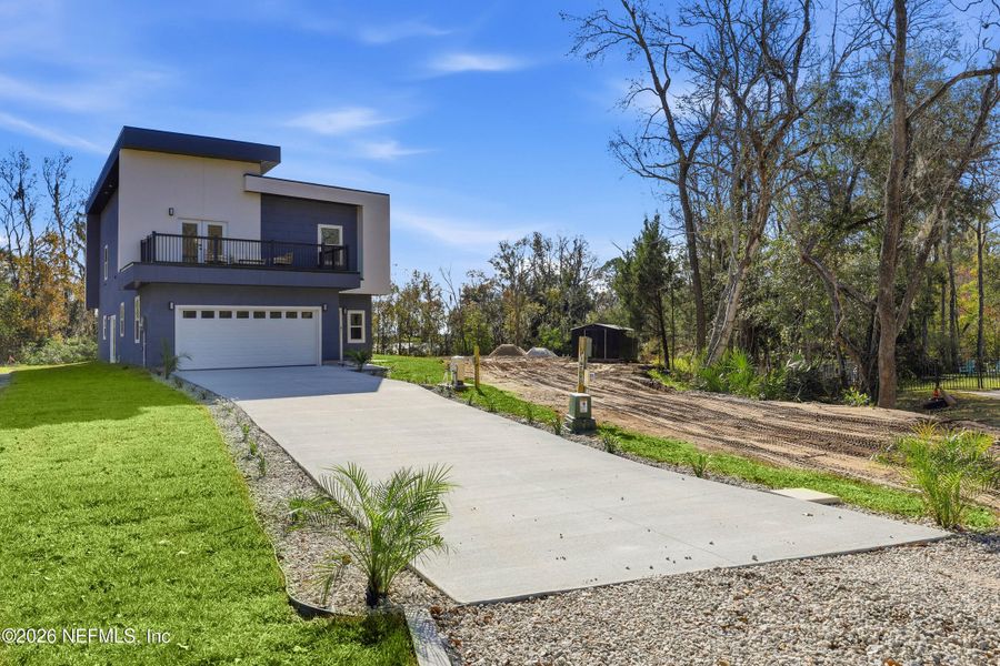 Front exterior of a new home in , Orange Park, FL, highlighting curb appeal (Image 20).