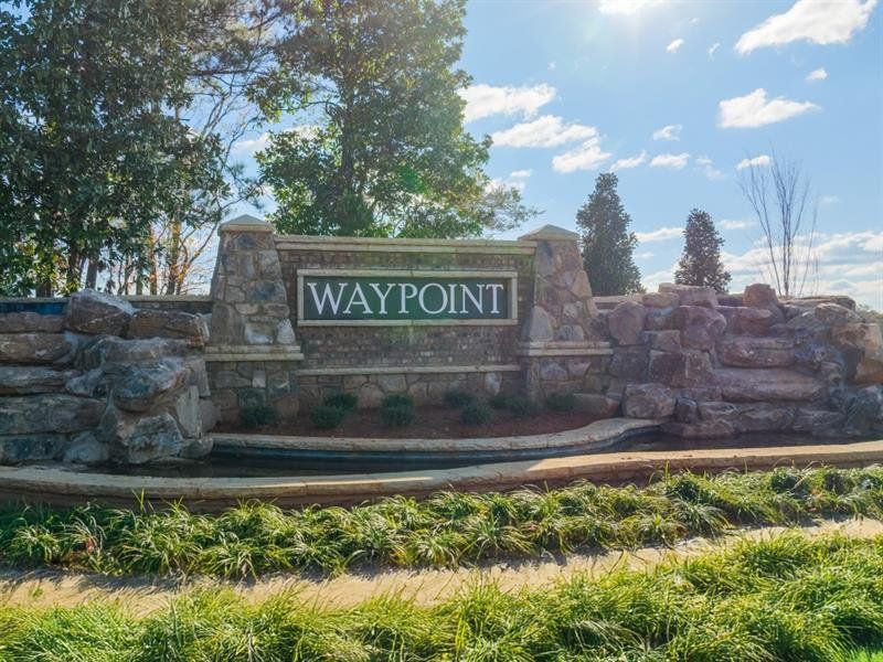 Front exterior of a new home in Waypoint, Flowery Branch, GA, highlighting curb appeal (Image 2).