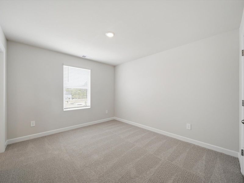 Spacious, unfurnished interior of a new home in The Farm at Wells Creek - Signature Collection, Gray Court (Image 18).