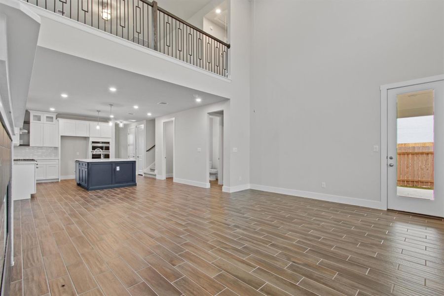 Unfurnished living room with a high ceiling