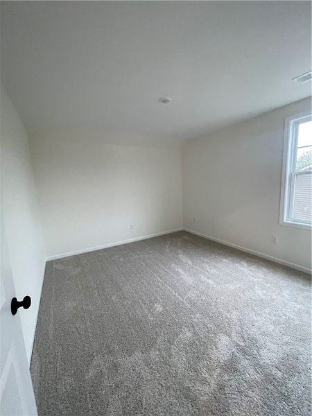 Spacious, unfurnished interior of a new home in Springwood Grove, Central (Image 34).