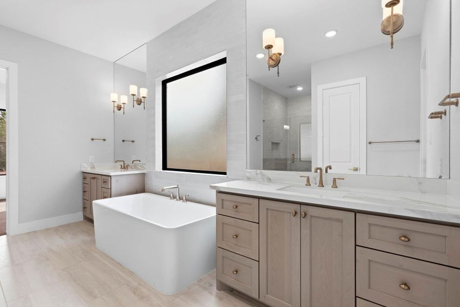 Primary bathroom with beautiful finishes and stand alone tub