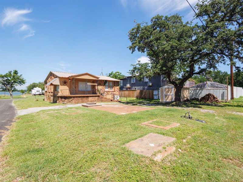 Back of the house, firepit, and back yard