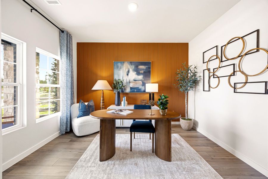 A room with a table and chairs.