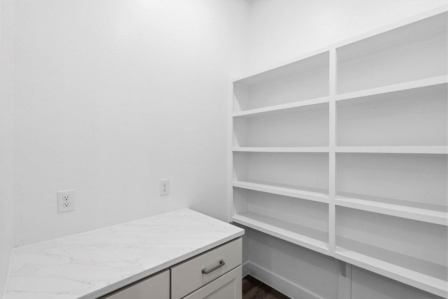 Furnished interior view inside a new home in Meridiana, Manvel (Image 8).