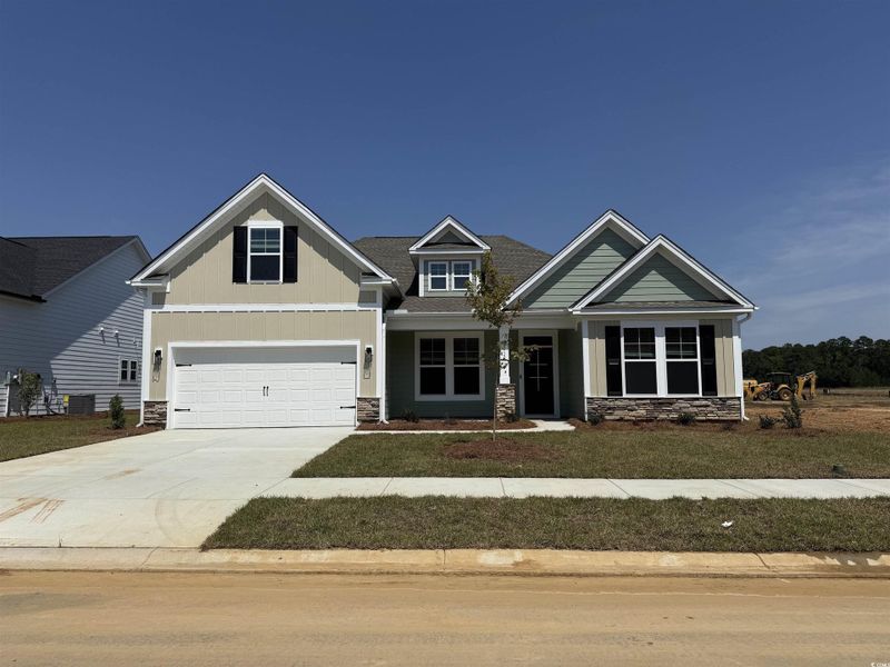 Front exterior of a new home in Westwood Reserve, Conway, SC, highlighting curb appeal (Image 1). Front exterior of a new home in Westwood Reserve, Conway, SC, highlighting curb appeal (Image 1).