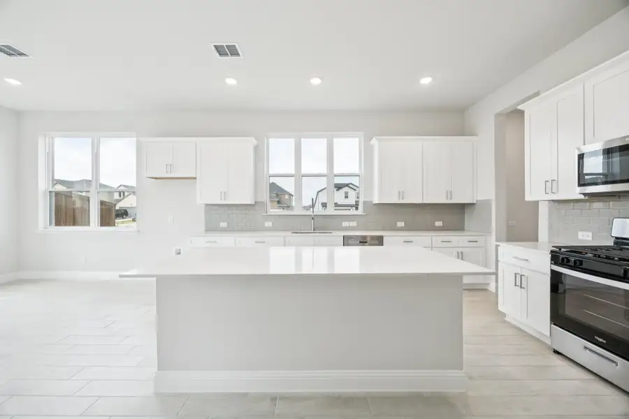 Representative furnished interior of a home built from the Regency II by Megatel Homes in Bellagio, Forney (Image 3).