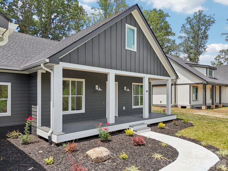 Front exterior of a new home in , Hendersonville, NC, highlighting curb appeal (Image 24).