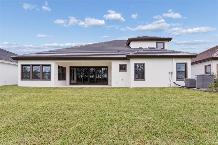 Exterior details and patio area of a home in Two Rivers, Zephyrhills (Image 3).