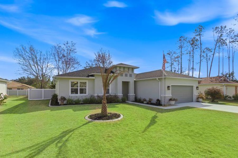 Front exterior of a new home in , Palm Coast, FL, highlighting curb appeal (Image 21).