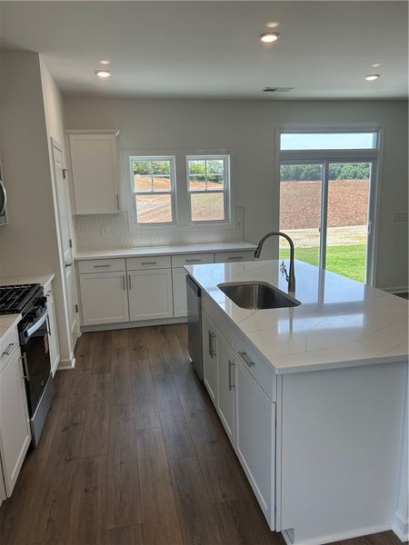 A well-lit kitchen with a modern design and ample