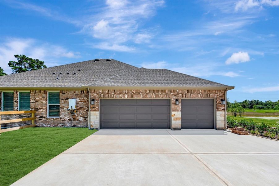 Front exterior of a new home in Lone Star Landing, Montgomery, TX, highlighting curb appeal (Image 21). Front exterior of a new home in Lone Star Landing, Montgomery, TX, highlighting curb appeal (Image 21).