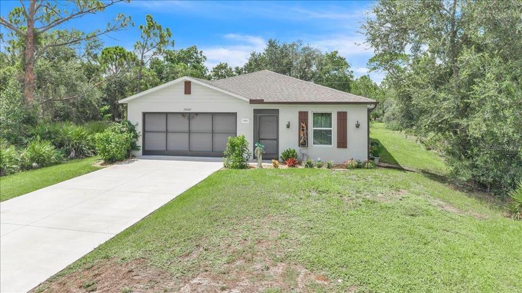 Front exterior of a new home in , Punta Gorda, FL, highlighting curb appeal (Image 1). Front exterior of a new home in , Punta Gorda, FL, highlighting curb appeal (Image 1).
