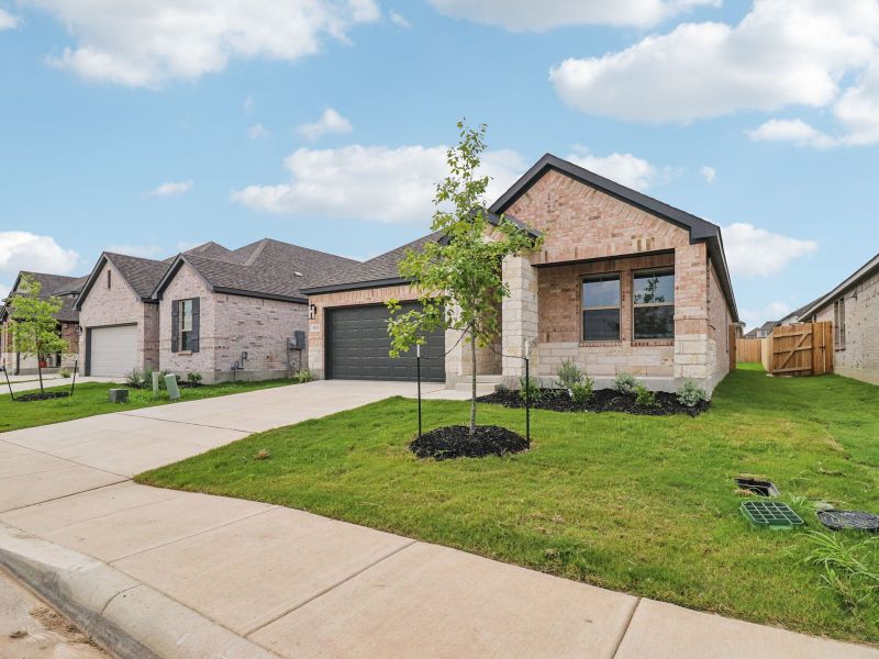 Front exterior of a new home in Kallison Ranch, San Antonio, TX, highlighting curb appeal (Image 20).