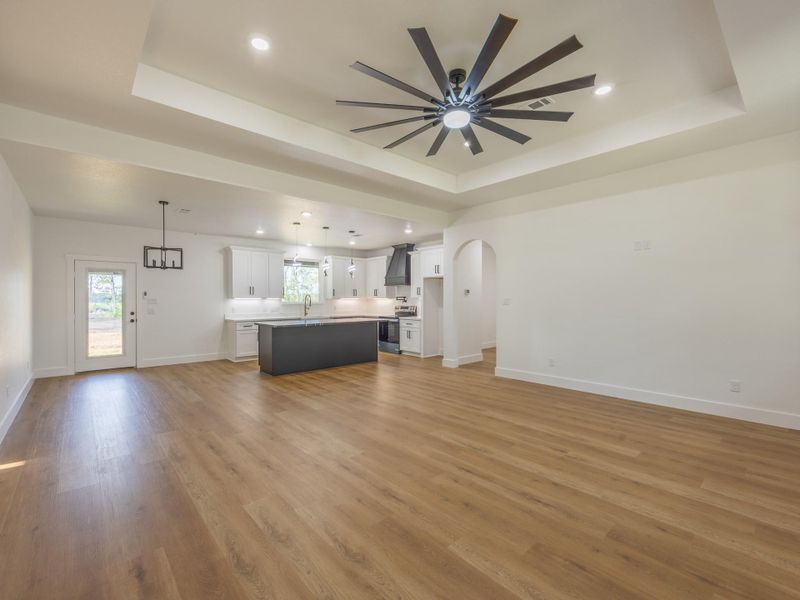 Designed for modern lifestyles, this view highlights the open layout that connects the stylish kitchen, elegant dining area, and comfortable living room—ideal for entertaining or everyday living. Designed for modern lifestyles, this view highlights the open layout that connects the stylish kitchen, elegant dining area, and comfortable living room—ideal for entertaining or everyday living.