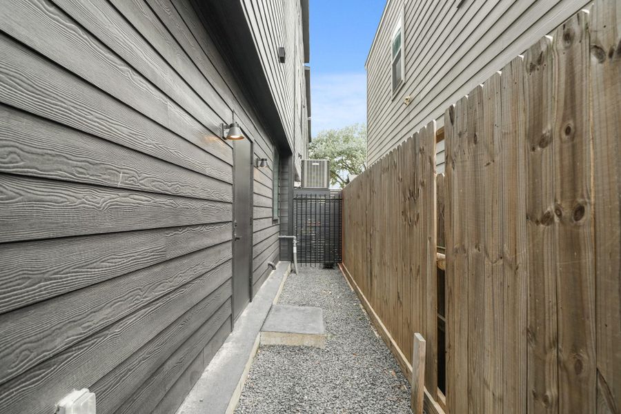 A view o the backyard which is perfect for pets or a BBQ grill!