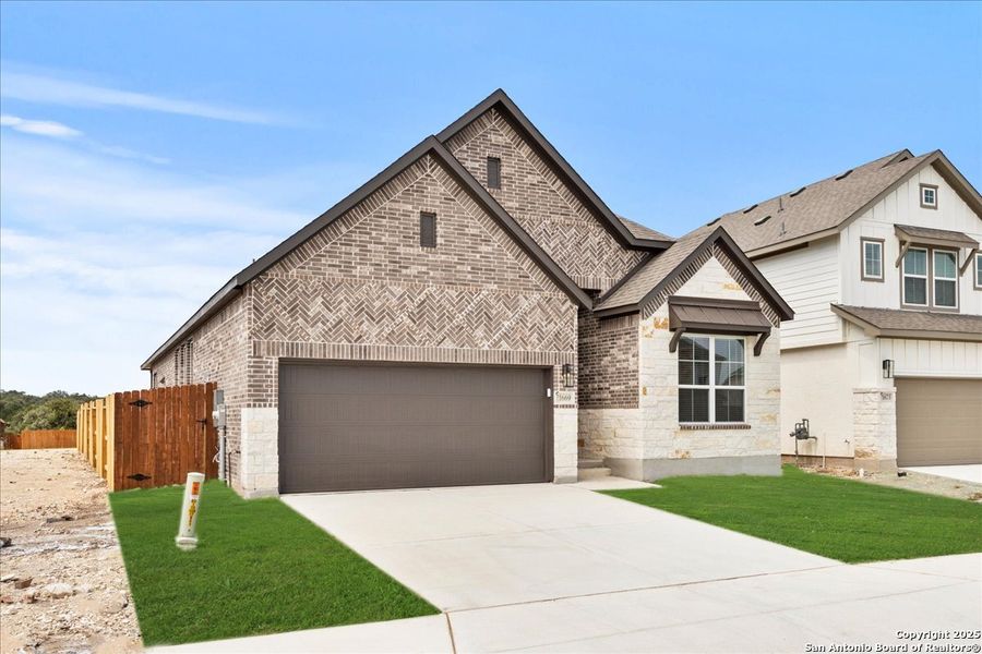 Front exterior of a new home in Meyer Ranch, New Braunfels, TX, highlighting curb appeal (Image 13). Front exterior of a new home in Meyer Ranch, New Braunfels, TX, highlighting curb appeal (Image 13).