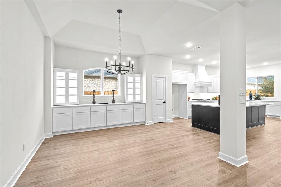 Beautiful Dining area with built in cabinets & coiffered ceiling!