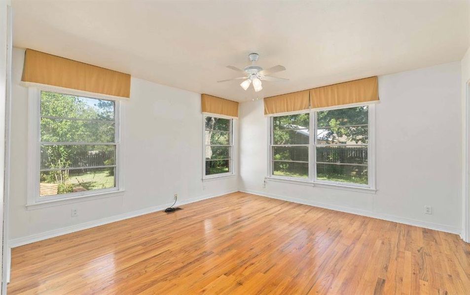Spare room featuring light wood-type flooring and ceiling fan