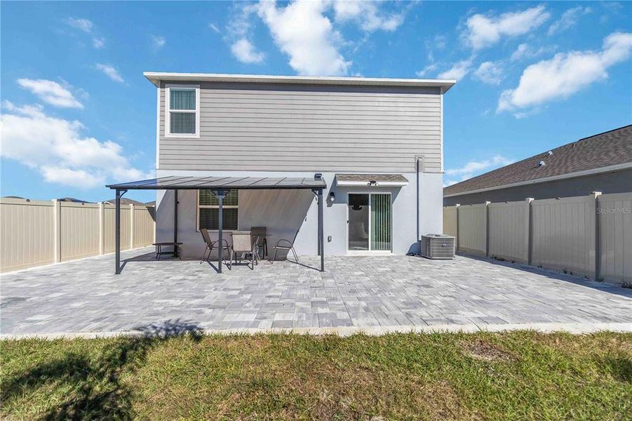 Exterior details and patio area of a home in Peace Creek Reserve: Manor Key Collection, Winter Haven (Image 3).